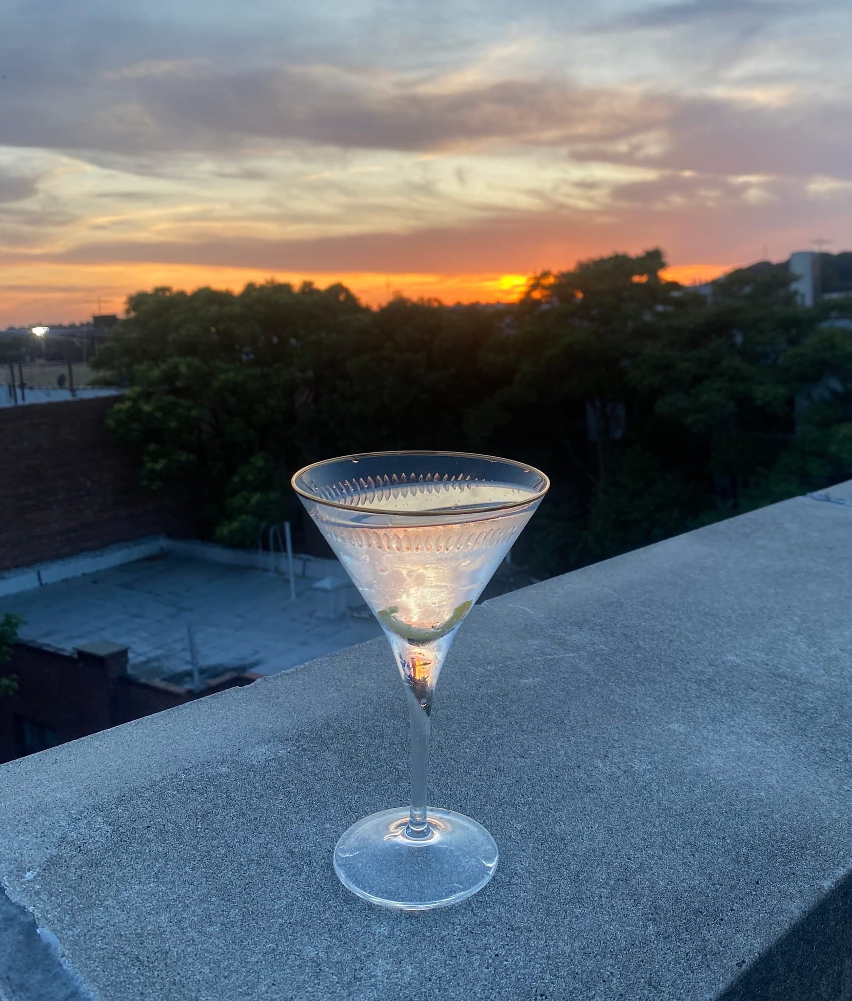 Martini on my roof with the sunset behind it