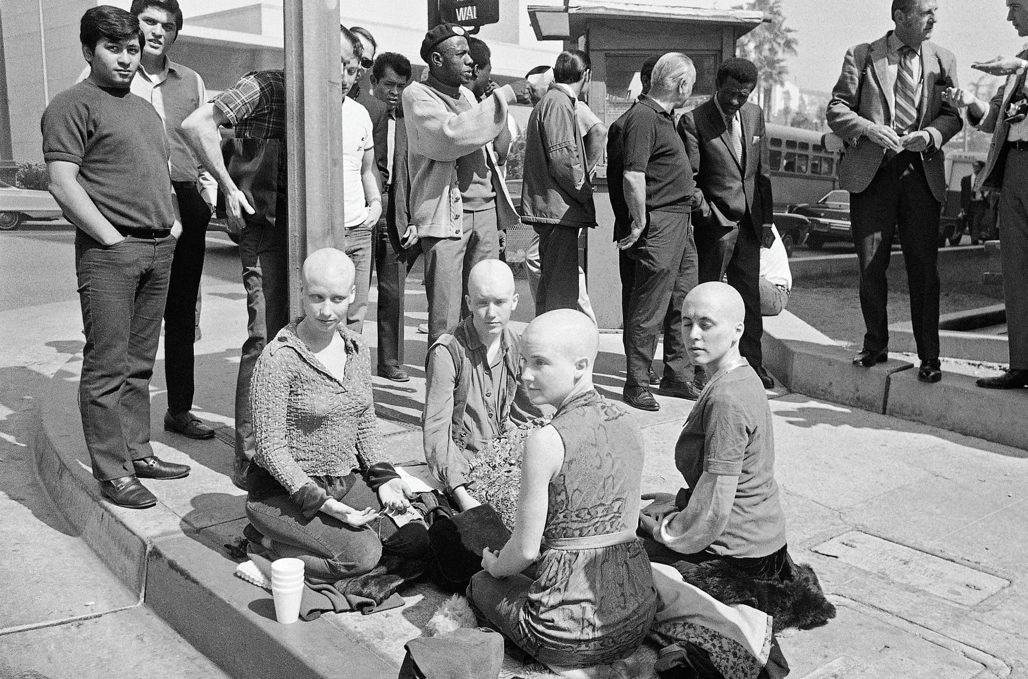 The Manson Family girls with shaved heads outside the courtyard