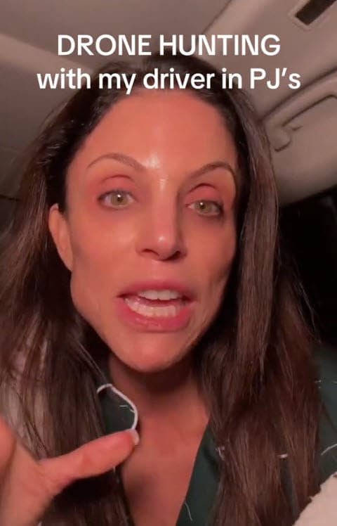 A screenshot from Bethenny’s tiktok in which she looks completely deranged, with the caption “drone hunting with my driver in PJs”