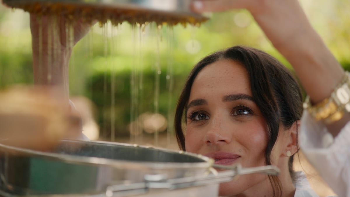 Meghan, Duchess of Sussex, staring at a bunch of honey, which seems to be 95% of her day