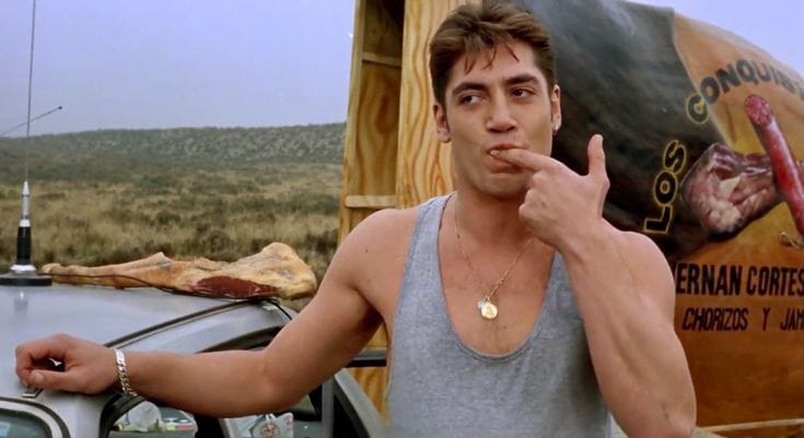 Javier Bardem at peak attractiveness in the movie Jamon Jamon, licking his finger in a very seductive manner, really no one should be allowed to be this attractive